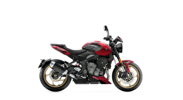 Czerwony motocykl Triumph Trident 660, jeden z najmocniejszych motocykli w swojej klasie, z czarnymi akcentami i złotymi felgami.