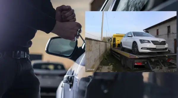 Próba kradzieży samochodu zakończona. Białe auto na lawecie, złodziej zatrzymany.